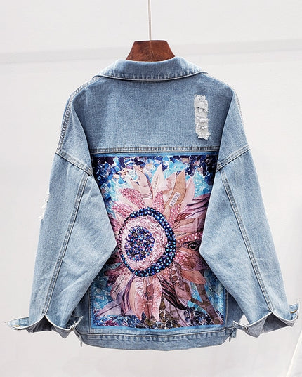 Damska kurtka jeansowa z nadrukiem na plecach i przetarciami