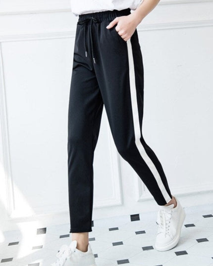 Damskie spodnie dresowe z prostymi nogawkami z białą lamówką