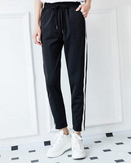 Damskie spodnie dresowe z prostymi nogawkami z białą lamówką