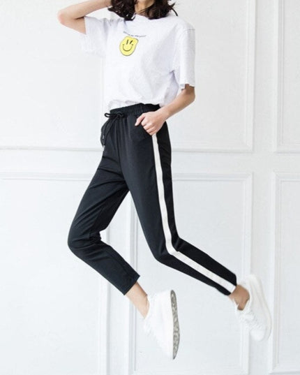 Damskie spodnie dresowe z prostymi nogawkami z białą lamówką