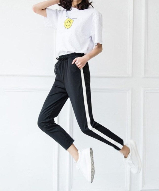 Damskie spodnie dresowe z prostymi nogawkami z białą lamówką