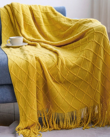 Koc z frędzlami i fakturą w romby