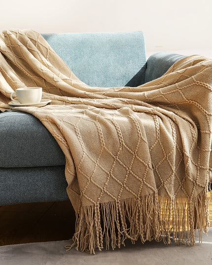 Koc z frędzlami i fakturą w romby