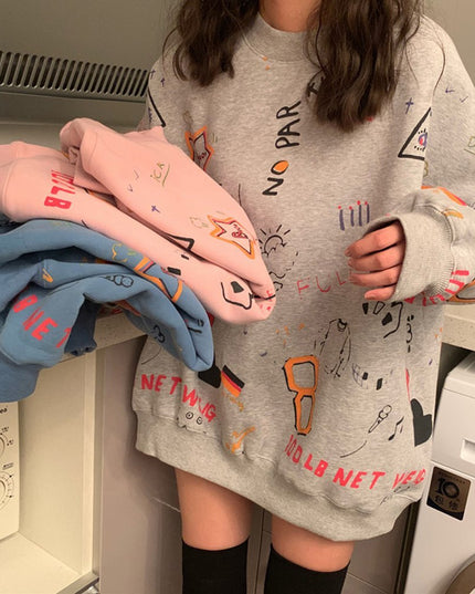 Damska bluza z nadrukami odręcznych rysunków