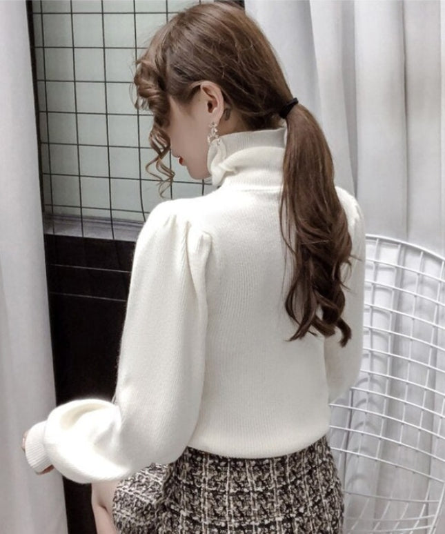 Damski sweter z golfem i bufiastymi rękawami