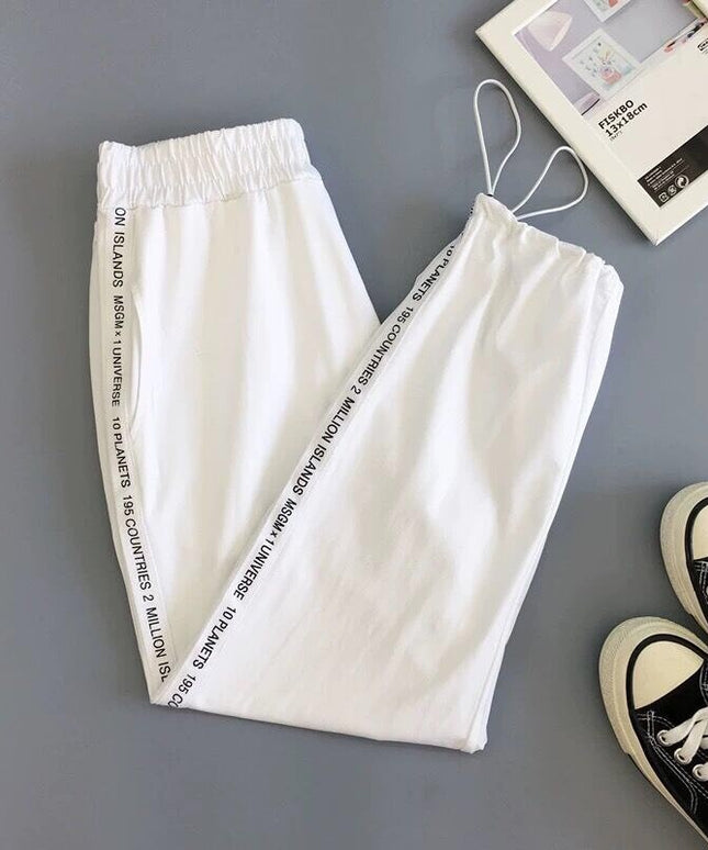 Damskie spodnie dresowe z napisami na nogawkach