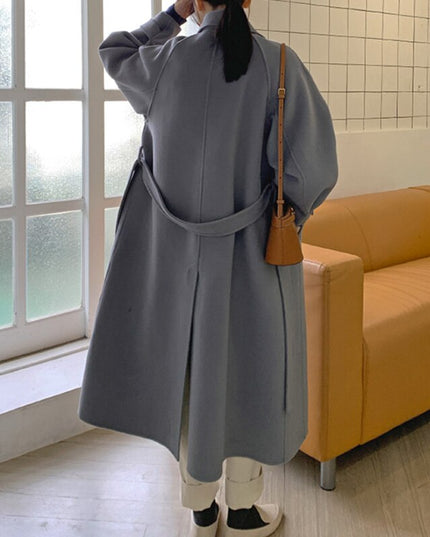 Damski długi płaszcz z wiązaniem w talii