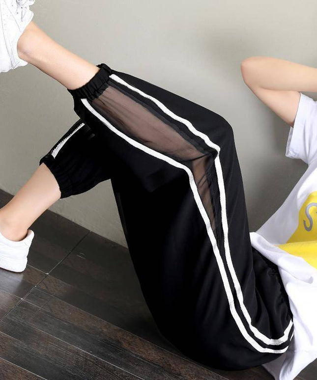 Damskie spodnie dresowe z ozdobną siateczką