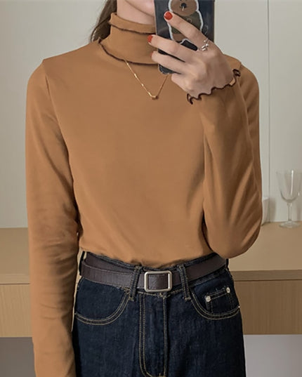 Damska koszulka z długim rękawem z golfem i falbanką