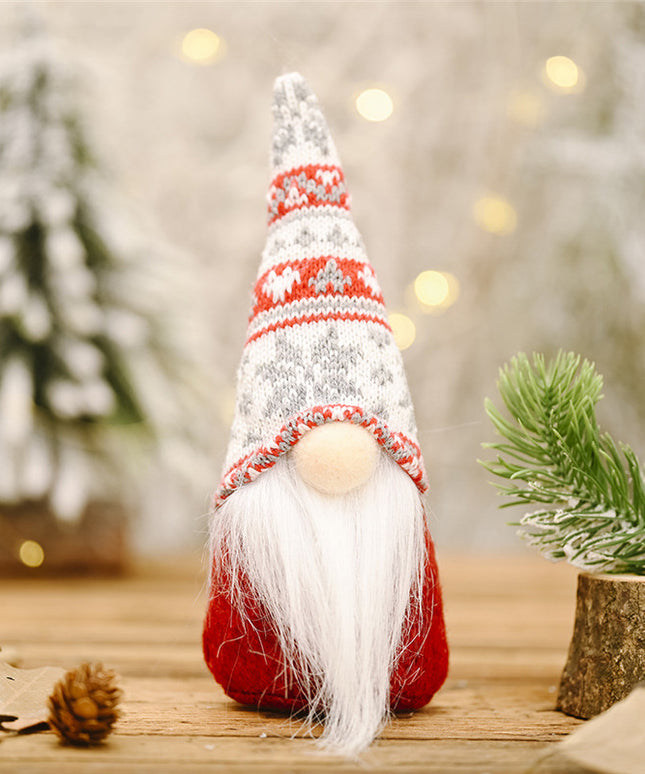 Świąteczny Bożonarodzeniowy skrzat krasnal czerwony z długą wzorzystą czapką