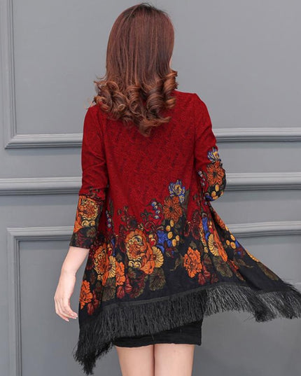 Damski sweter typu ponczo z frędzlami i haftem