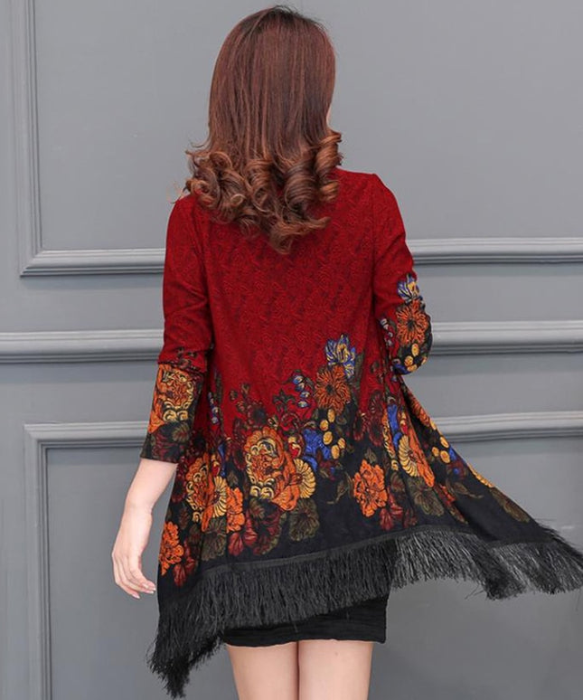 Damski sweter typu ponczo z frędzlami i haftem