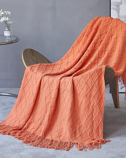 Koc z frędzlami i fakturą w romby