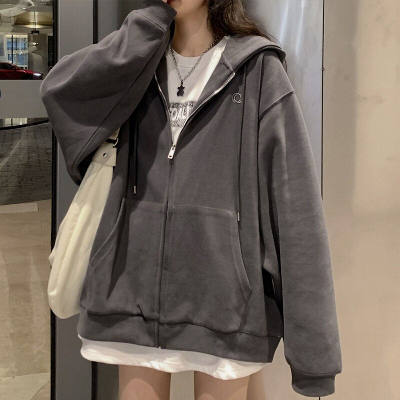 Damska bluza oversize rozpinana z kapturem i kieszeniami