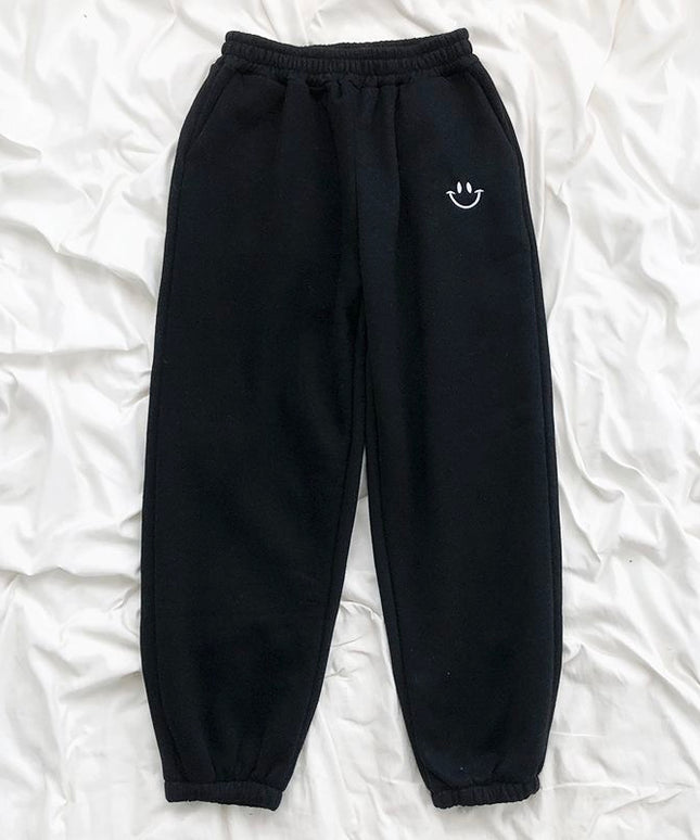 Damskie spodnie dresowe z naszywką