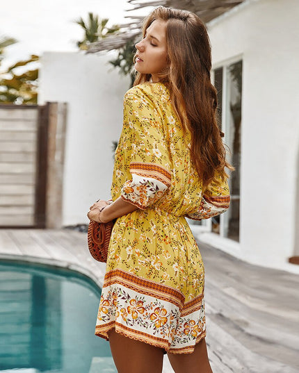 Damski kombinezon w kwiaty z rękawem 3/4