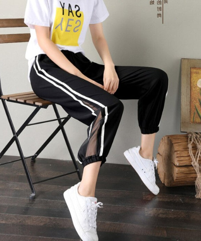 Damskie spodnie dresowe z ozdobną siateczką