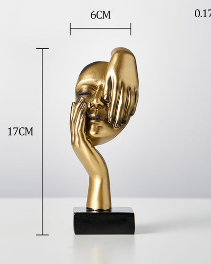 Figurka dekoracyjna twarz w złotych kolorach