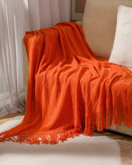 Koc z frędzlami i fakturą w romby