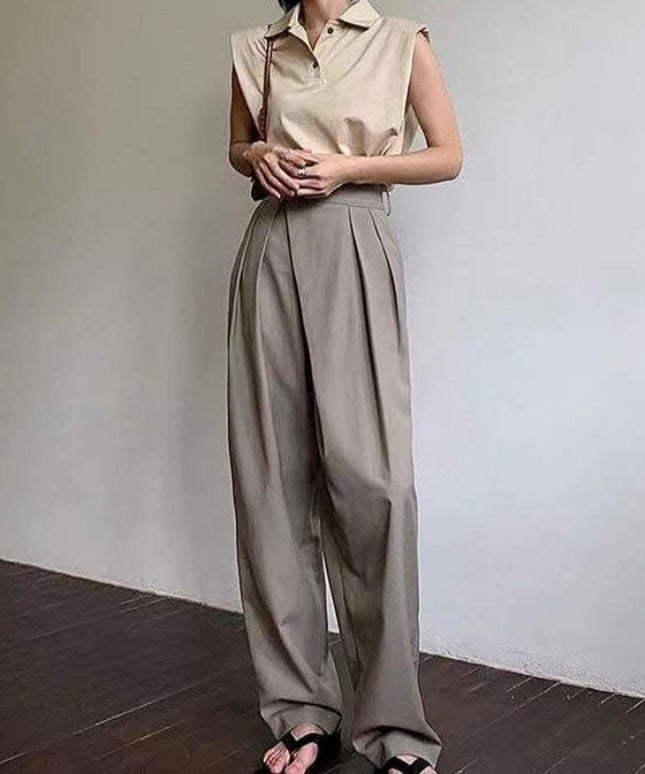 Damskie spodnie chinosy z szerokimi nogawkami i asymetrycznym zamkiem