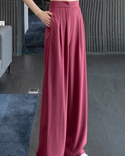 Damskie spodnie materiałowe taliowane z szerokimi nogawkami