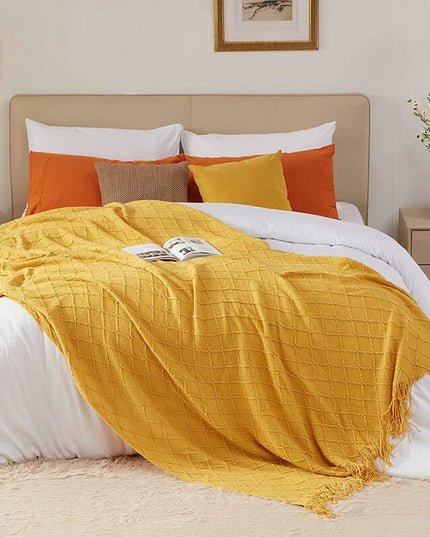 Koc z frędzlami i fakturą w romby