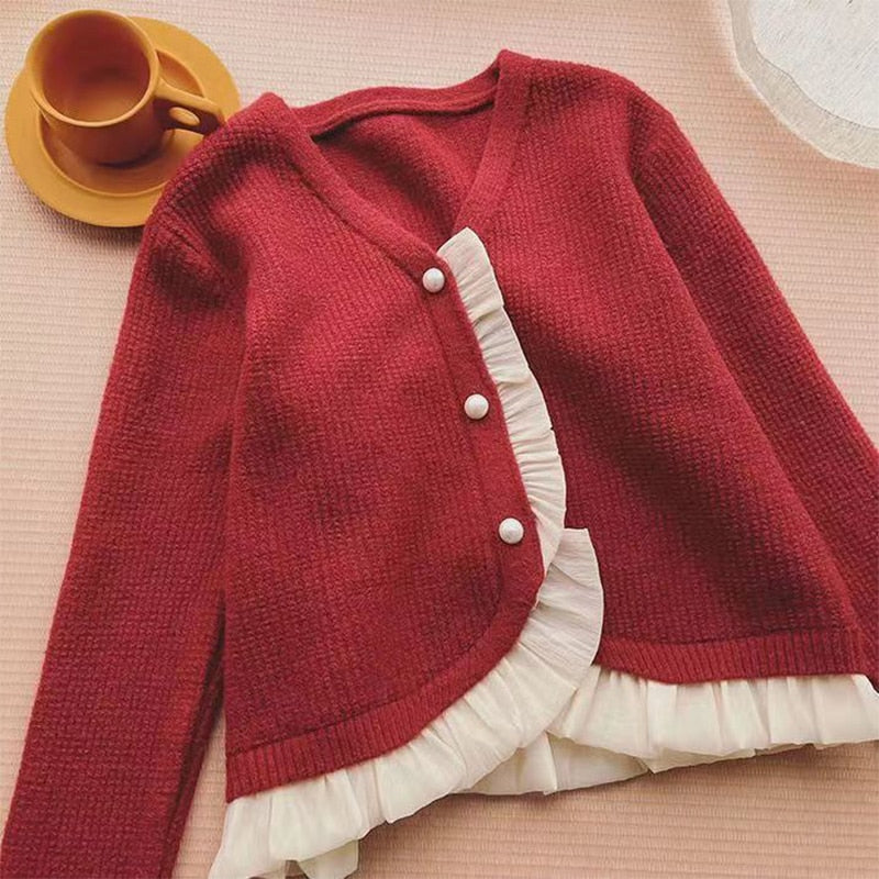 Damski sweter typu kardigan z falbanką
