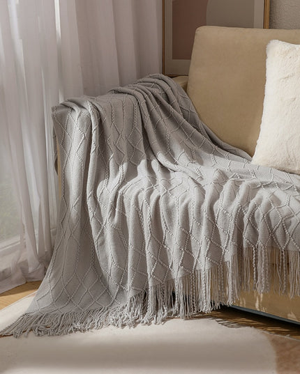 Koc z frędzlami i fakturą w romby