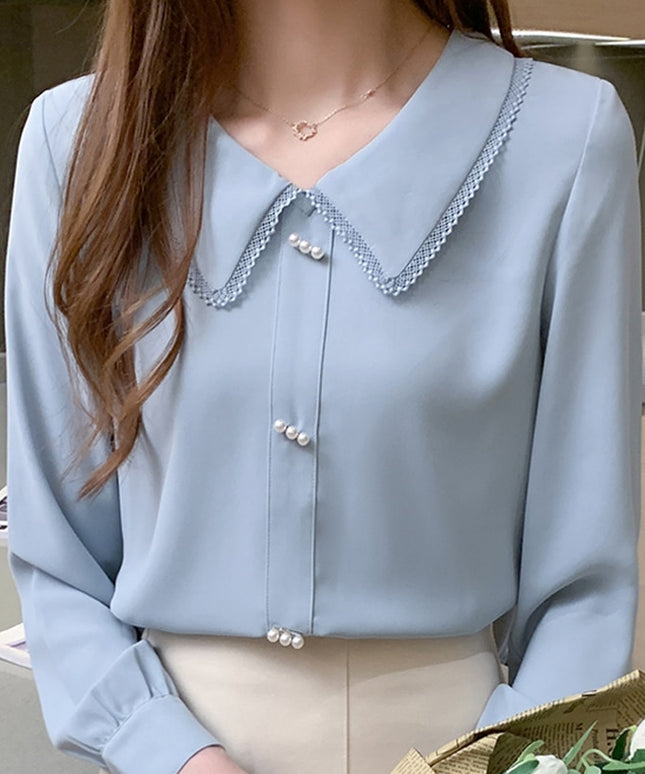 Damska koszula zapinana na perłowe guziki