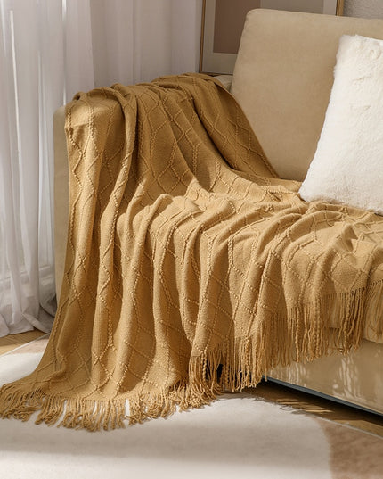 Koc z frędzlami i fakturą w romby