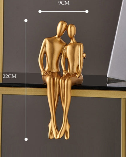 Figurka dekoracyjna postać w złotym kolorze