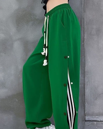 Damskie spodnie dresowe rozpinane po bokach