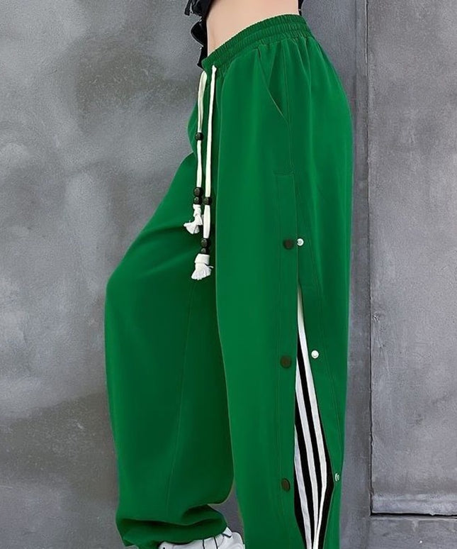 Damskie spodnie dresowe rozpinane po bokach