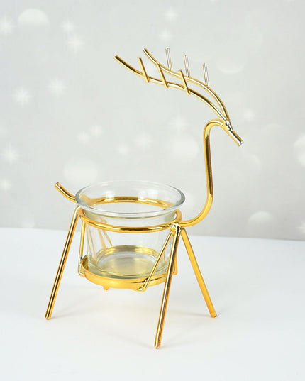 Metalowy złoty świecznik w kształcie renifera