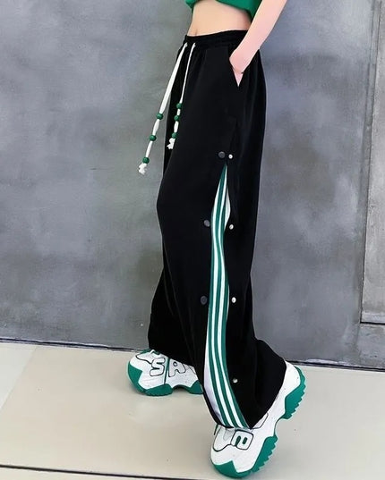 Damskie spodnie dresowe rozpinane po bokach