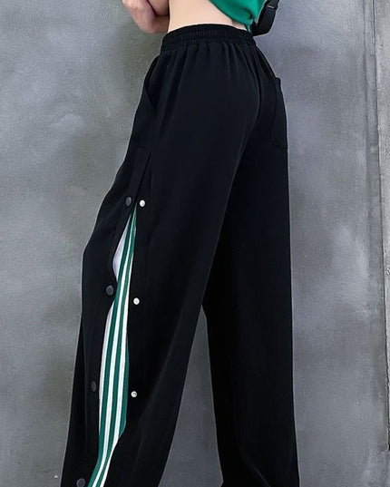 Damskie spodnie dresowe rozpinane po bokach