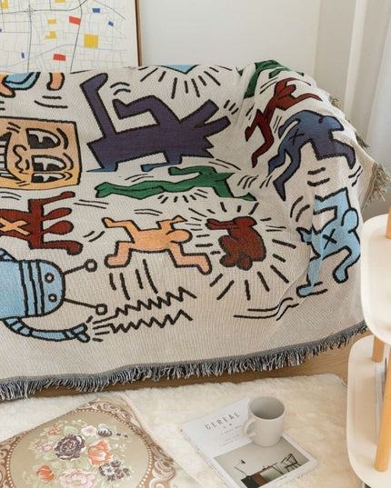 Pled z frędzlami w kolorowe rysunki