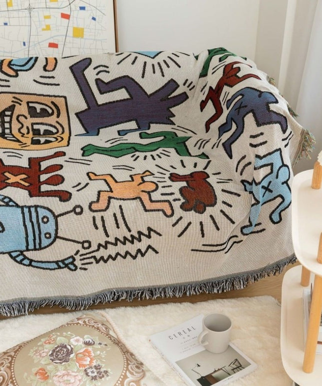 Pled z frędzlami w kolorowe rysunki