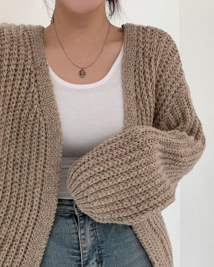 Damski sweter typu kardigan dziergany o kroju oversize