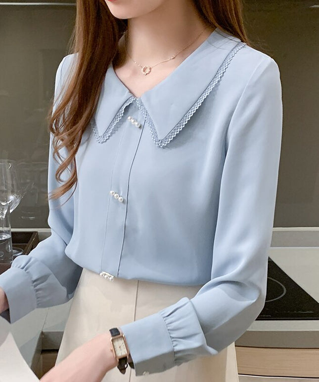 Damska koszula zapinana na perłowe guziki