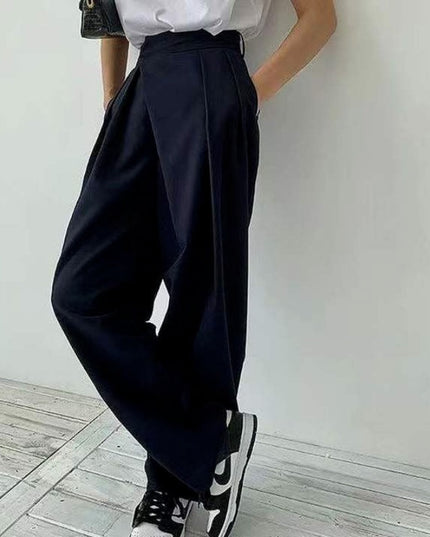 Damskie spodnie chinosy z szerokimi nogawkami i asymetrycznym zamkiem