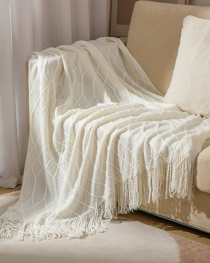 Koc z frędzlami i fakturą w romby