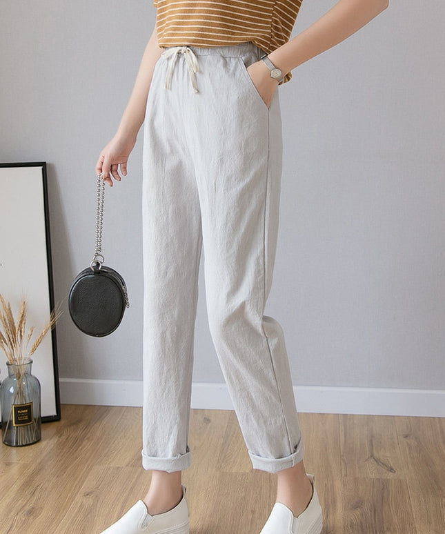 Damskie spodnie chinosy o prostym kroju z wiązaniem