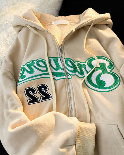 Damska bluza zapinana na zamek z naszywanym napisem