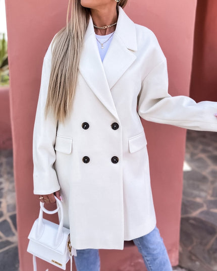 Damski płaszcz dwurzędowy długi z klapami