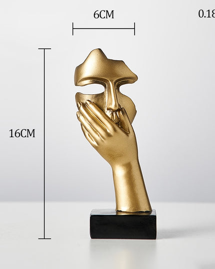 Figurka dekoracyjna twarz w złotych kolorach