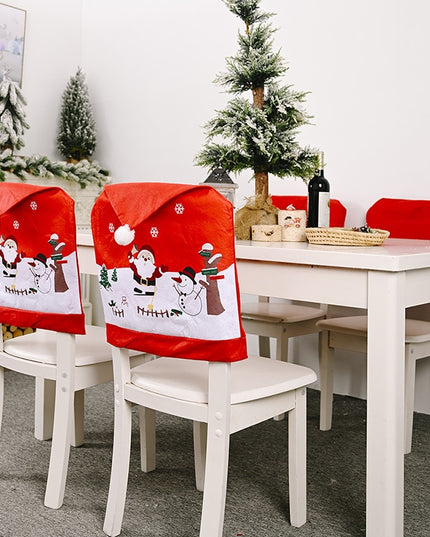 Świąteczny pokrowiec na krzesło z Mikołajem i bałwankiem
