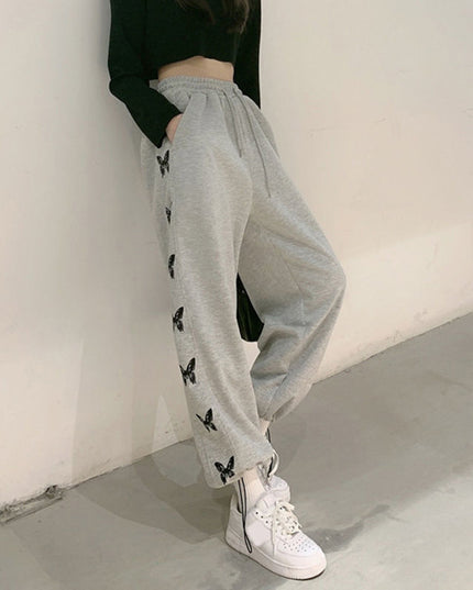 Damskie spodnie dresowe z motylami po bokach