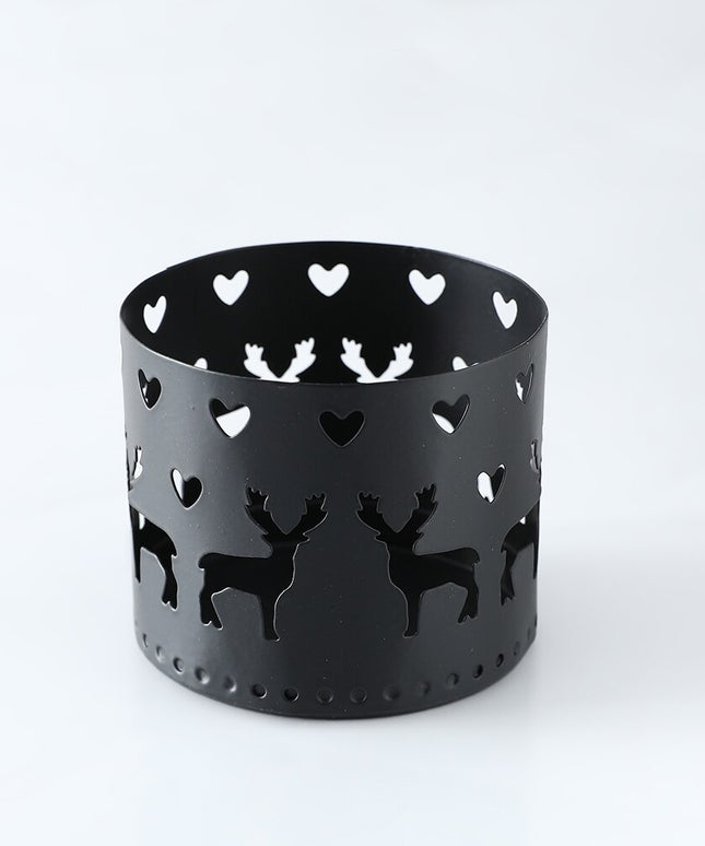 Świąteczny świecznik czarny z ażurowymi dekorami w kształcie reniferów