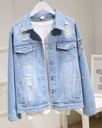 Damska kurtka jeansowa z haftem na plecach i przetarciami